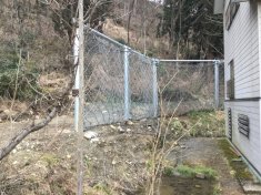 小泉3地区県単急傾斜地崩壊防止工事・公関落石防護柵工事